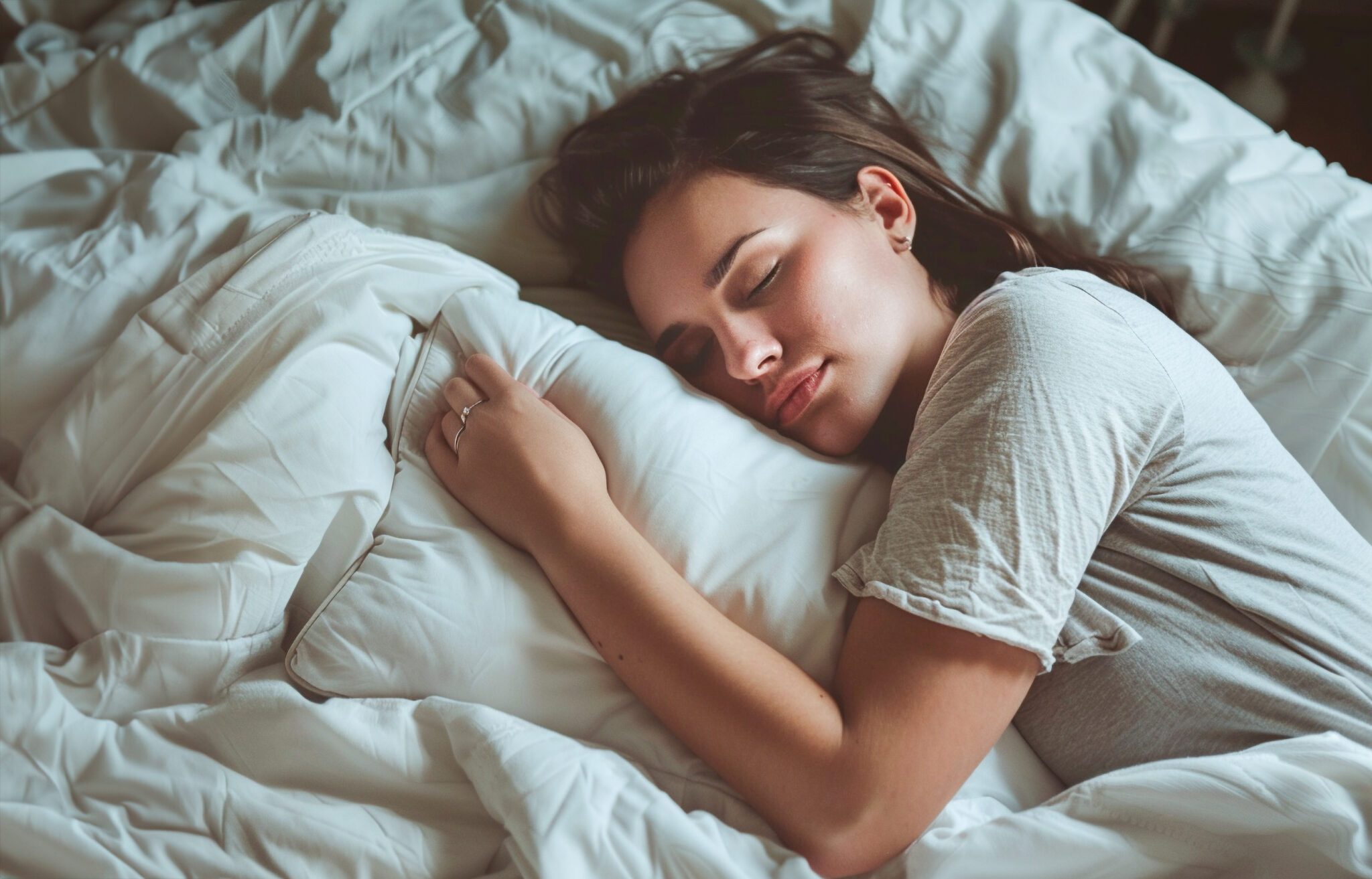 A woman sleeping soundly which is another benefit of swimming.